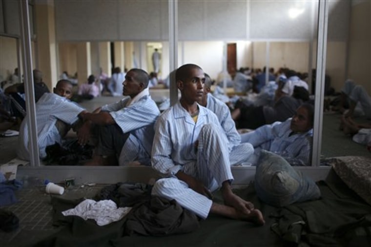 Pro-Gadhafi soldiers rest in a school converted into a prison in Tripoli, Libya, Monday, Aug. 29, 2011. (AP Photo/Alexandre Meneghini)
